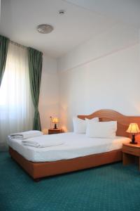 Postel nebo postele na pokoji v ubytování Hotel Sir Orhideea