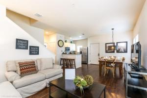 a living room with a couch and a table at Lucaya Village Resort Townhome Unit 14 Townhouse in Orlando