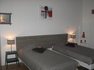 Кровать или кровати в номере Les Jardins du Golf