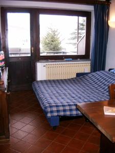 Giường trong phòng chung tại Sestriere @ Residence Palace 1 +13 ảnh