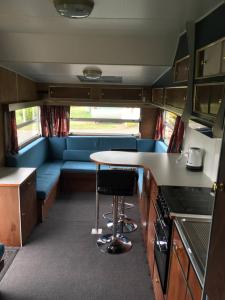 a kitchen and living room in an rv at Riverton Holiday Park in Riverton