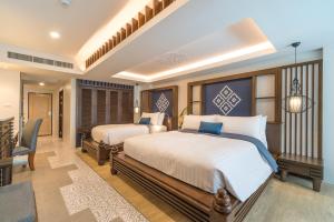 Кровать или кровати в номере Aonang Princeville Villa Resort & Spa - GHA WellHotel-Halal Certified, Krabi, Thailand