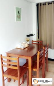 
a dining room table with chairs and a table cloth at Good Dream Hotel (Khun Ying House) in Ko Tao
