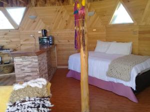 Ένα ή περισσότερα κρεβάτια σε δωμάτιο στο domoschiloe