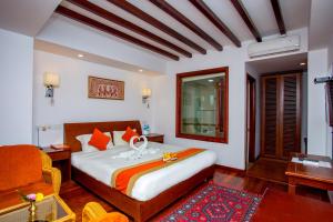 Ένα ή περισσότερα κρεβάτια σε δωμάτιο στο Apsara Boutique Hotel