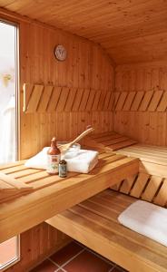 a sauna with a sink and towels in it at Reiterhof Zwei Linden in Melle