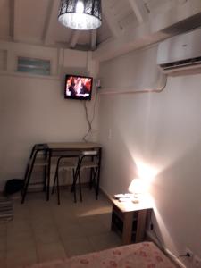 TV a/nebo společenská místnost v ubytování Le Saint Georges