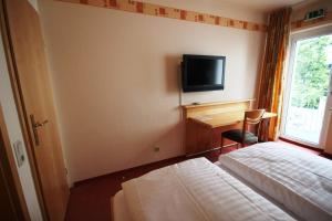 מיטה או מיטות בחדר ב-Hotel Glockengasse
