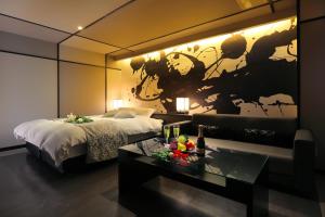 Postel nebo postele na pokoji v ubytování HOTEL 小粋 -coiki-