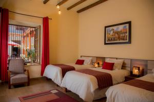 Un pat sau paturi într-o cameră la La Casona Monsante