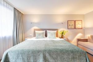Postel nebo postele na pokoji v ubytování Hotel Admiral