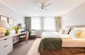 Postel nebo postele na pokoji v ubytování Hotel Admiral