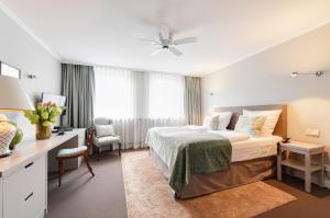 Postel nebo postele na pokoji v ubytování Hotel Admiral