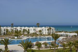 a view of a resort with a swimming pool and the ocean at Vincci Helios Beach in Midoun