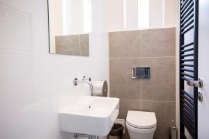 a bathroom with a sink and a toilet at Sophie's Hostel in Prague