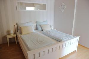 A bed or beds in a room at Apartments Obdach