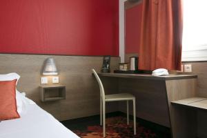 Ένα ή περισσότερα κρεβάτια σε δωμάτιο στο Hotel Clermont Estaing