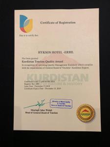 un certificato di registrazione su un foglio bianco di Hyksos Hotel a Erbil