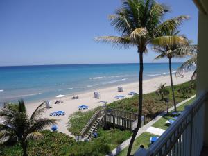 a beach with palm trees and palm trees at Delray Sands Resort in Boca Raton