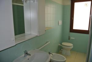 Ett badrum på Condominio LISA