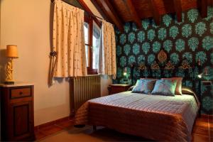 Postel nebo postele na pokoji v ubytování Casa Rural Villa Gervasio