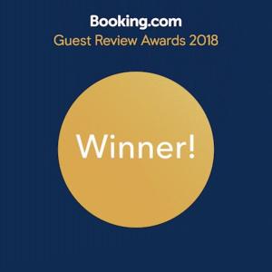 a yellow circle with the words guest review awards at Soffio Di Mare in Porto Recanati