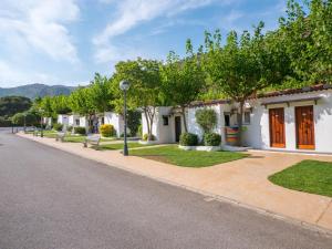 a row of houses on the side of a street at Ciudad De Vacaciones Cala Montjoi in Roses