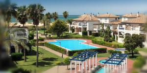 an aerial view of a resort with a swimming pool at Leo San Bruno in Isla Canela