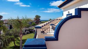 a view from the balcony of a house with blue stairs at Leo San Bruno in Isla Canela
