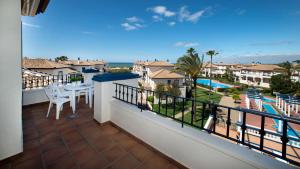 a balcony with a view of a resort at Leo San Bruno in Isla Canela