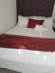 Postel nebo postele na pokoji v ubytování MZET GUEST HOUSE