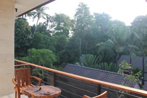 Balkón nebo terasa v ubytování Indah Bali Guesthouse