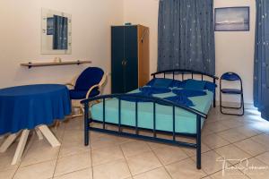 Postel nebo postele na pokoji v ubytování Apartments Natali