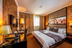 Voodi või voodid majutusasutuse Hotel Délibáb toas