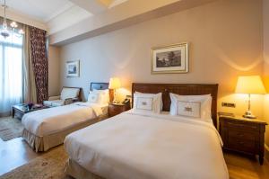 Postel nebo postele na pokoji v ubytování Pera Palace Hotel