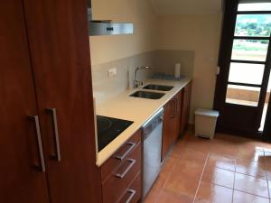 A kitchen or kitchenette at Ático Nuevo con vistas