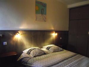 Postel nebo postele na pokoji v ubytování Hotel Valérie