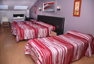 Postel nebo postele na pokoji v ubytování Hotel Villa de Cacabelos