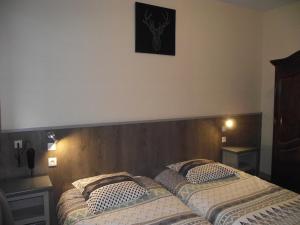 Postel nebo postele na pokoji v ubytování Hotel Valérie