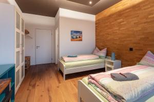 
Ein Bett oder Betten in einem Zimmer der Unterkunft Andi's BnB
