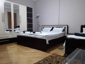 Postel nebo postele na pokoji v ubytování Guesthouse Zeinabi