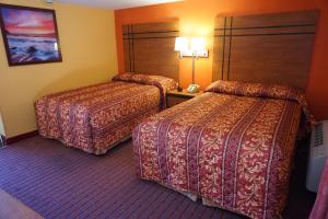 a hotel room with two beds in a room at RELAX INN in Vineland