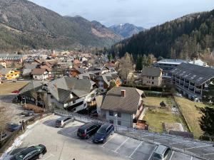 a small town with cars parked in a parking lot at Apartment MEGI in Kranjska Gora