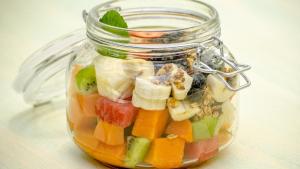 a glass jar filled with fruit and vegetables at The Beach Tulum Hotel in Tulum
