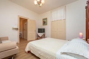 En eller flere senge i et værelse på Apartment Matić
