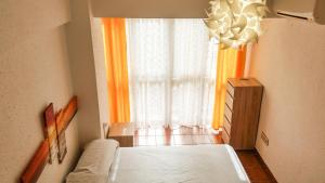 Posteľ alebo postele v izbe v ubytovaní Luchana Apartment