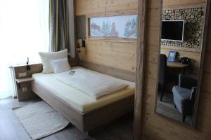 Posteľ alebo postele v izbe v ubytovaní Märchenhotel 3 Sterne Superior Waldpension Nebelstein