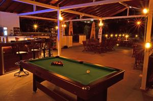 a pool table in front of a patio with a bar at Konfor Suite Otel in Oludeniz