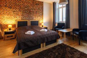 Postel nebo postele na pokoji v ubytování Apartamenty Vilda