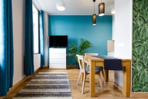 TV a/nebo společenská místnost v ubytování Apartamenty Vilda